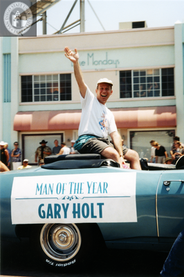 Gary Holt waving to crowd at Pride parade