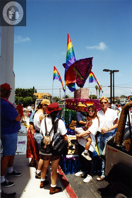 Individuals looking at parked float for The Center at Pride parade, 1998