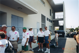 Participants standing behind The Center waiting for Pride parade, 1996