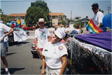 Individual wearing "We the people" hat at Pride parade, 1996