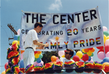 "The Center celebrating 20 years of family pride" banner at Pride parade