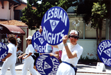 Ann Ramsey holding up "Lesbian Rights" sign in Pride parade, 1992