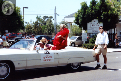 Queen Eddie rides on the back of a convertible in Pride parade, 1992