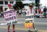 Diane Germain and Pam Gusha with signs at Pride parade, 1992