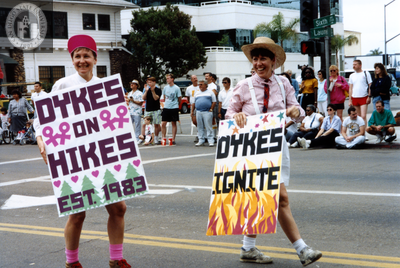 Diane Germain and Pam Gusha with signs at Pride parade, 1992