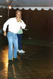 Merle Johnson on dance floor smiling at Pride festival, 1995