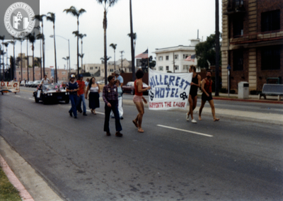 "Hillcrest Hotel supports the cause" banner in Pride parade, 1982