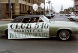 Club 540 banner on green car in Pride parade, 1982