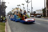 Float with "Proud, Diverse, and Unified" sign at Pride parade, 1982
