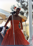 Singer in red dress at San Diego Pride Festival, 1989