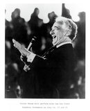 Victor Borge laughs into microphone