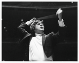 Charles Ketcham waves a conducting baton