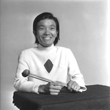 Tatsuo Sasaki smiles with percussion mallets