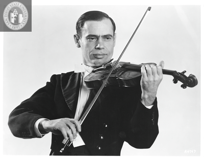 Leonid Kogan poses with violin