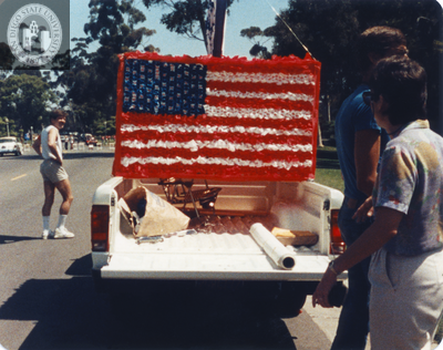 United States flag in a pickup truck for Gay Ballot Parade, 1984