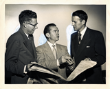 Lionel Van Deerlin stands with two unidentified men in suits
