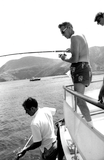 Lionel Van Deerlin fishing, with two unidentified men