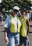 Two people in safety vests at the San Diego Pride Festival, 1997